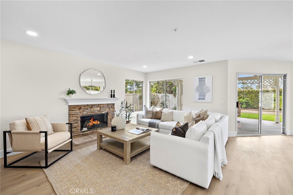 17 Rhode Island Irvine, CA 92606 - Photo 16 of 62 a living room with furniture and a fireplace