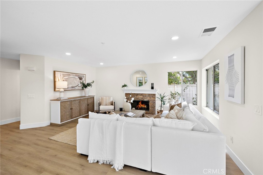 17 Rhode Island Irvine, CA 92606 - Photo 17 of 62 a living room with furniture a fireplace and a table