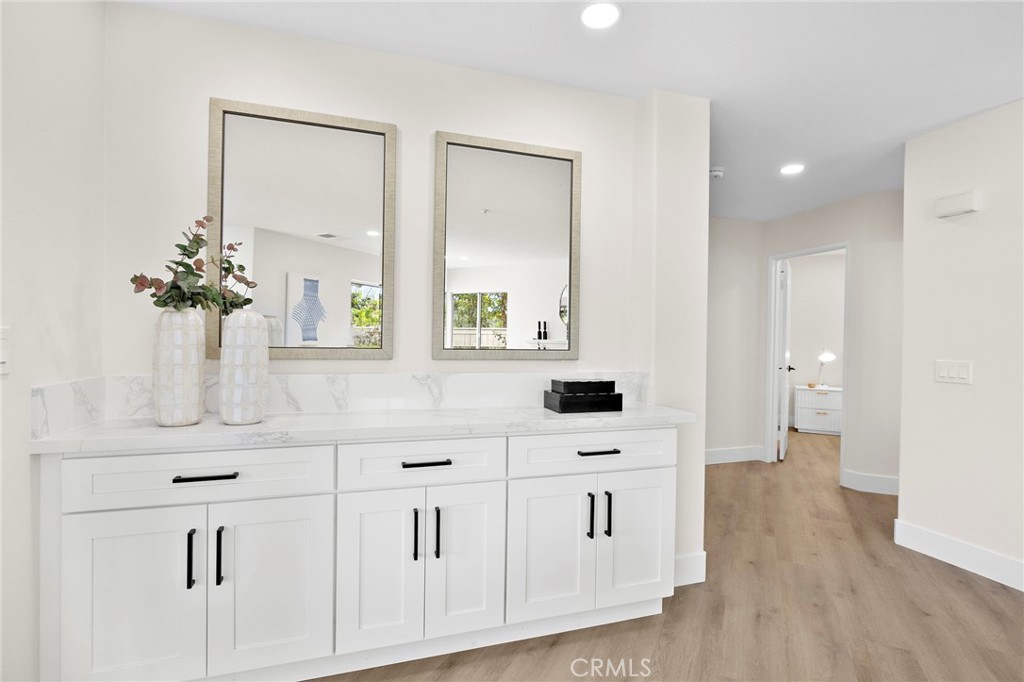 17 Rhode Island Irvine, CA 92606 - Photo 20 of 62 a bathroom with a sink a mirror and a toilet