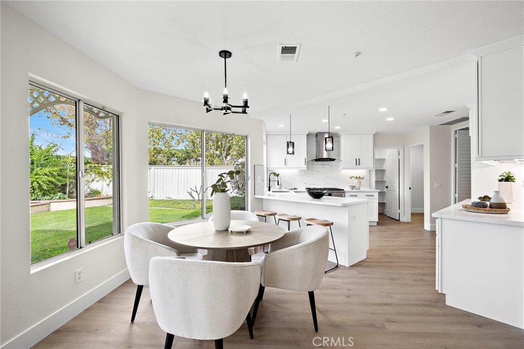 17 Rhode Island Irvine, CA 92606 - Photo 22 of 62 a view of a dining room with furniture window and wooden floor