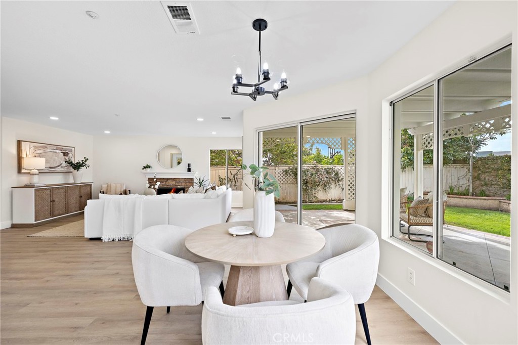 17 Rhode Island Irvine, CA 92606 - Photo 23 of 62 a view of a dining room with furniture window and wooden floor