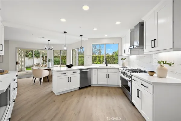 a bedroom with a bed and a potted plant
