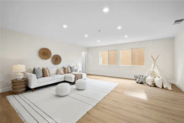 a bedroom with bed and window