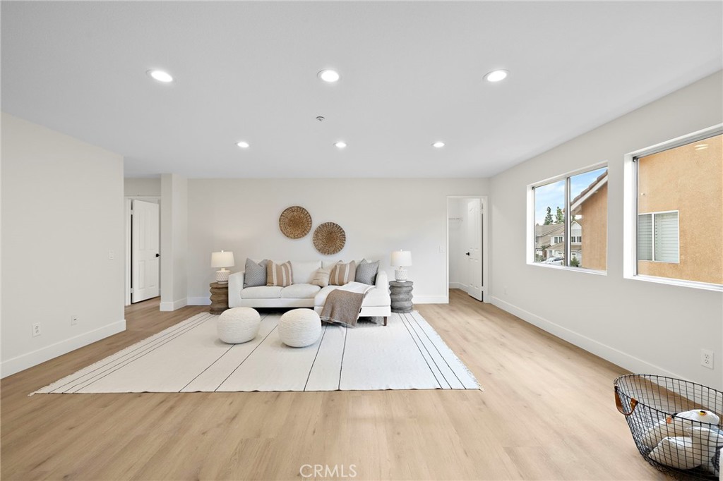 17 Rhode Island Irvine, CA 92606 - Photo 35 of 62 a living room with furniture and a large window