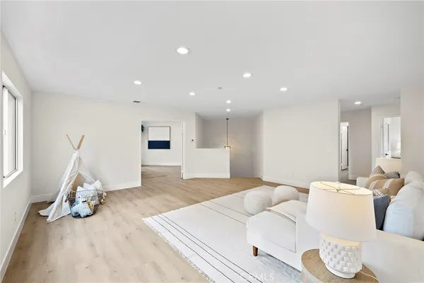 a bedroom with a bed and a chair