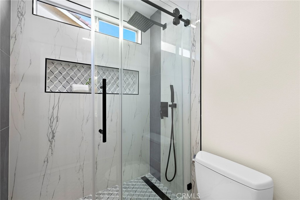 17 Rhode Island Irvine, CA 92606 - Photo 40 of 62 a bathroom with a toilet and a shower