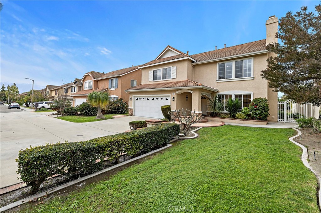 17 Rhode Island Irvine, CA 92606 - Photo 4 of 62 a front view of a house with garden and sitting area