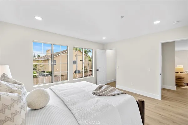 a large white kitchen with a large window