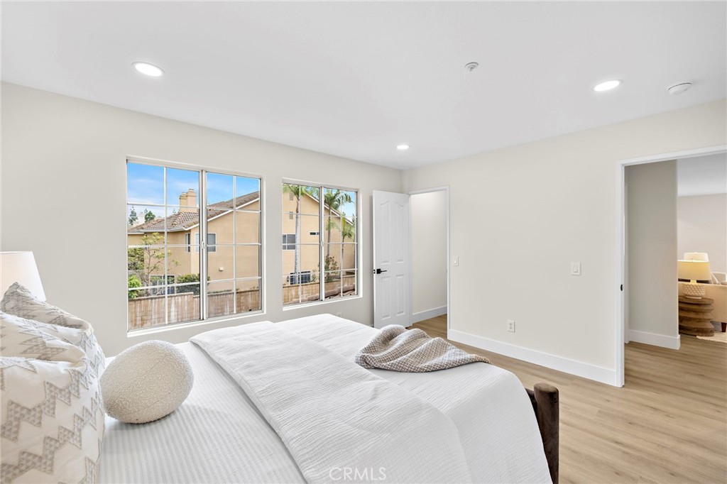 17 Rhode Island Irvine, CA 92606 - Photo 42 of 62 a bedroom with a bed and a large window