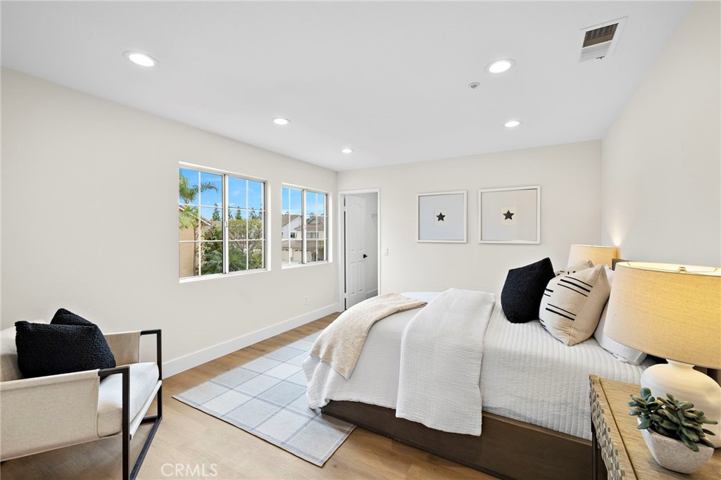 17 Rhode Island Irvine, CA 92606 - Photo 43 of 62 a bedroom with a bed and a chair