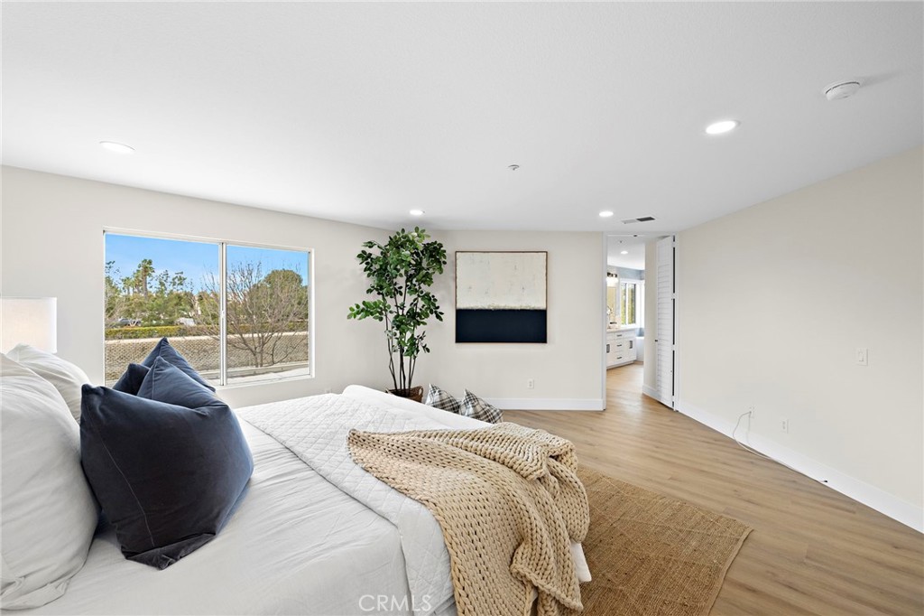 17 Rhode Island Irvine, CA 92606 - Photo 46 of 62 a bedroom with a large bed and a large window