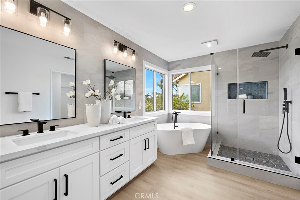 17 Rhode Island Irvine, CA 92606 - Photo 48 of 62 a bathroom with a double vanity sink mirror bathtub and shower