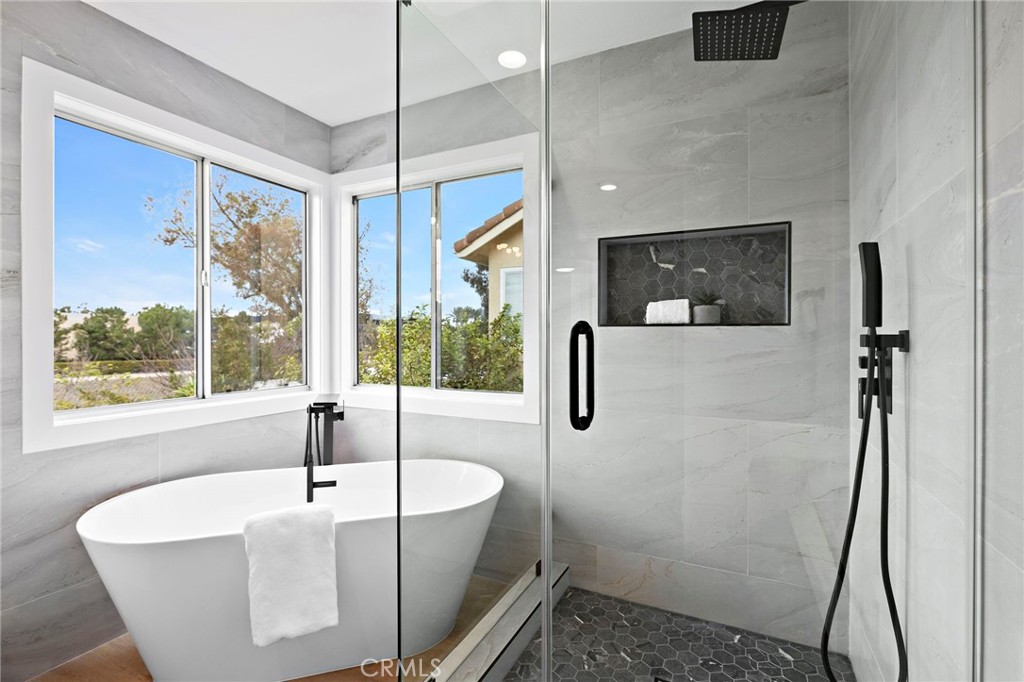17 Rhode Island Irvine, CA 92606 - Photo 50 of 62 a white bath tub sitting in a bathroom next to a window