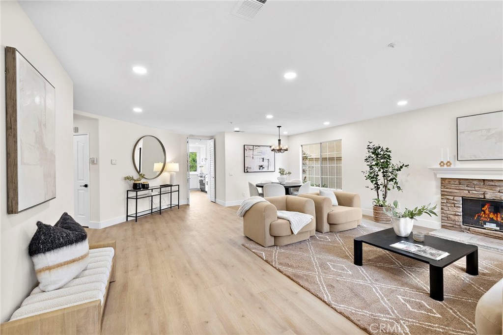 17 Rhode Island Irvine, CA 92606 - Photo 6 of 62 a living room with furniture and a fireplace