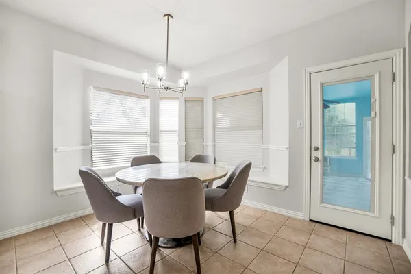 a kitchen with stainless steel appliances granite countertop sink stove top oven and microwave
