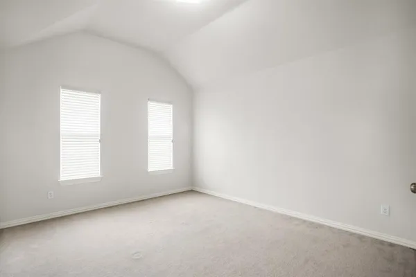 a spacious bathroom with a granite countertop sink a mirror and a vanity