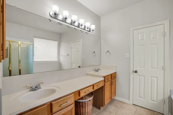 a bathroom with a bathtub and a window