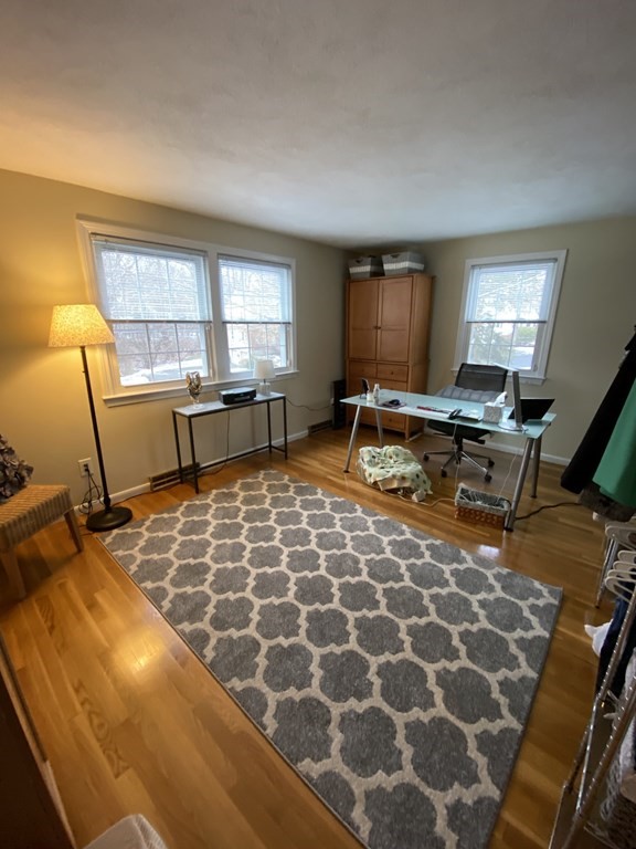 16 Bacon Road Framingham, MA 01701 - Photo 11 of 30 a living room with a couch and a table