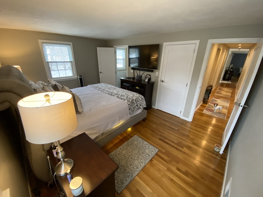 16 Bacon Road Framingham, MA 01701 - Photo 14 of 30 a bed sitting in a bedroom next to a window