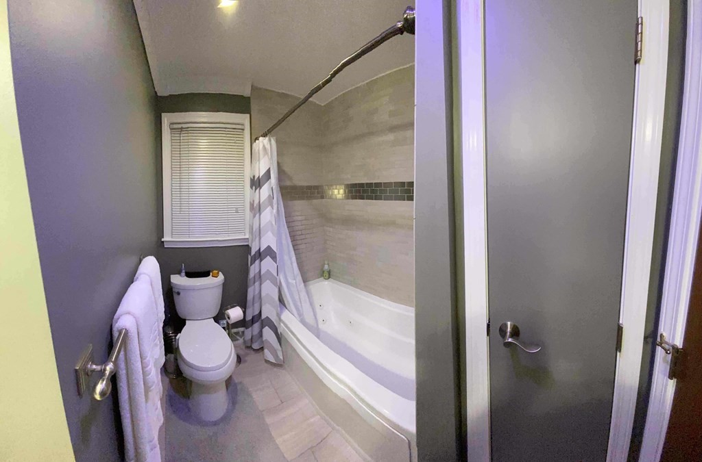 16 Bacon Road Framingham, MA 01701 - Photo 15 of 30 a bathroom with a bathtub and toilet