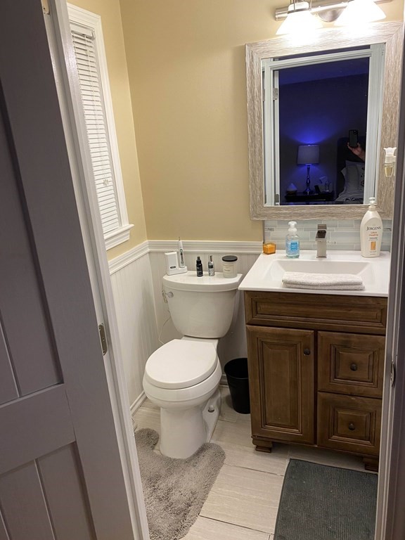 16 Bacon Road Framingham, MA 01701 - Photo 16 of 30 a bathroom with a toilet sink and mirror