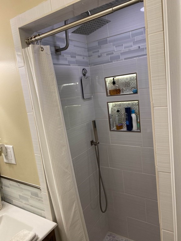 16 Bacon Road Framingham, MA 01701 - Photo 17 of 30 a bathroom with a shower and a sink