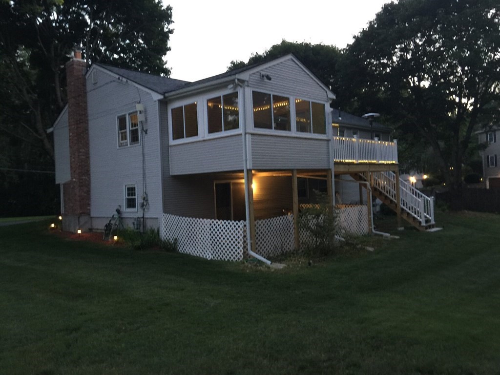 16 Bacon Road Framingham, MA 01701 - Photo 2 of 30 a front view of a house with a yard