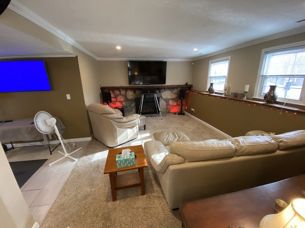 16 Bacon Road Framingham, MA 01701 - Photo 21 of 30 a living room with furniture and a flat screen tv