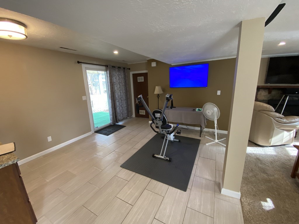 16 Bacon Road Framingham, MA 01701 - Photo 22 of 30 a living room with furniture a air conditioner vent and a window