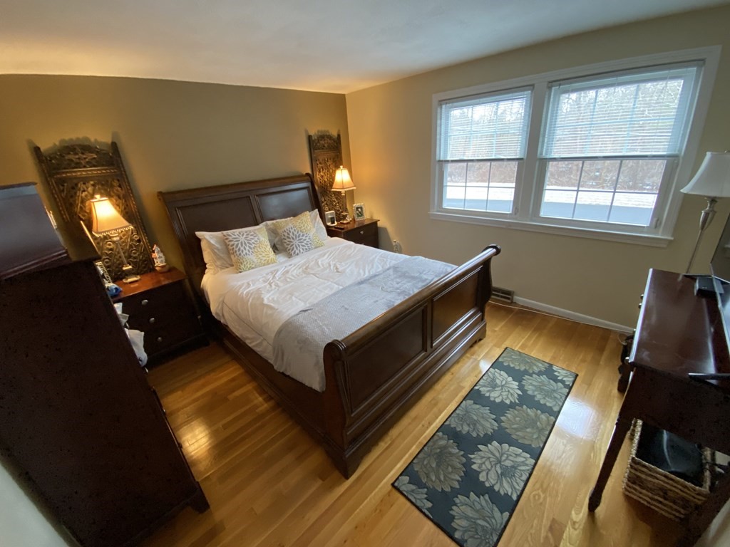 16 Bacon Road Framingham, MA 01701 - Photo 9 of 30 a bed sitting in a bedroom next to a window