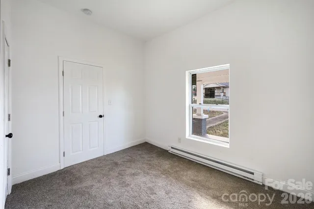 a view of a room that has a window in it