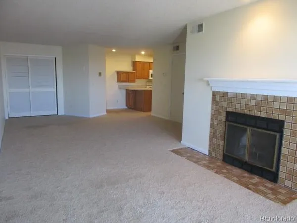 a view of a livingroom and a fireplace