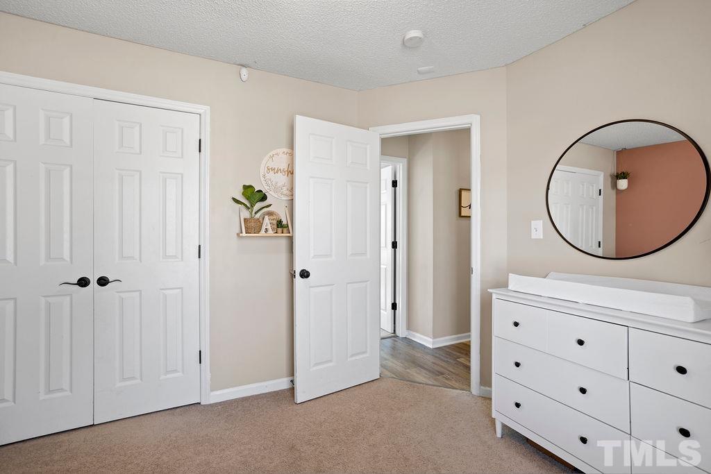 7929 Flower Hill Road Middlesex, NC 27557 - Photo 17 of 28 an entryway with closet and mirror
