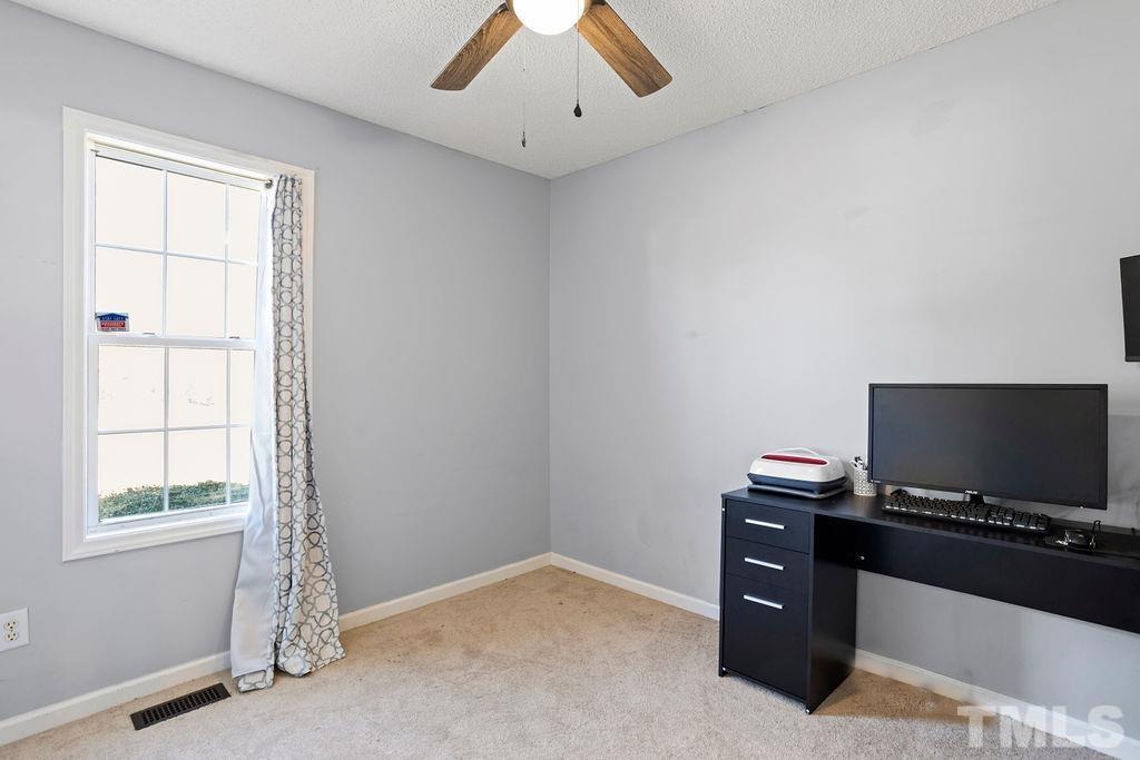 7929 Flower Hill Road Middlesex, NC 27557 - Photo 18 of 28 a view of workspace with window and flat screen tv