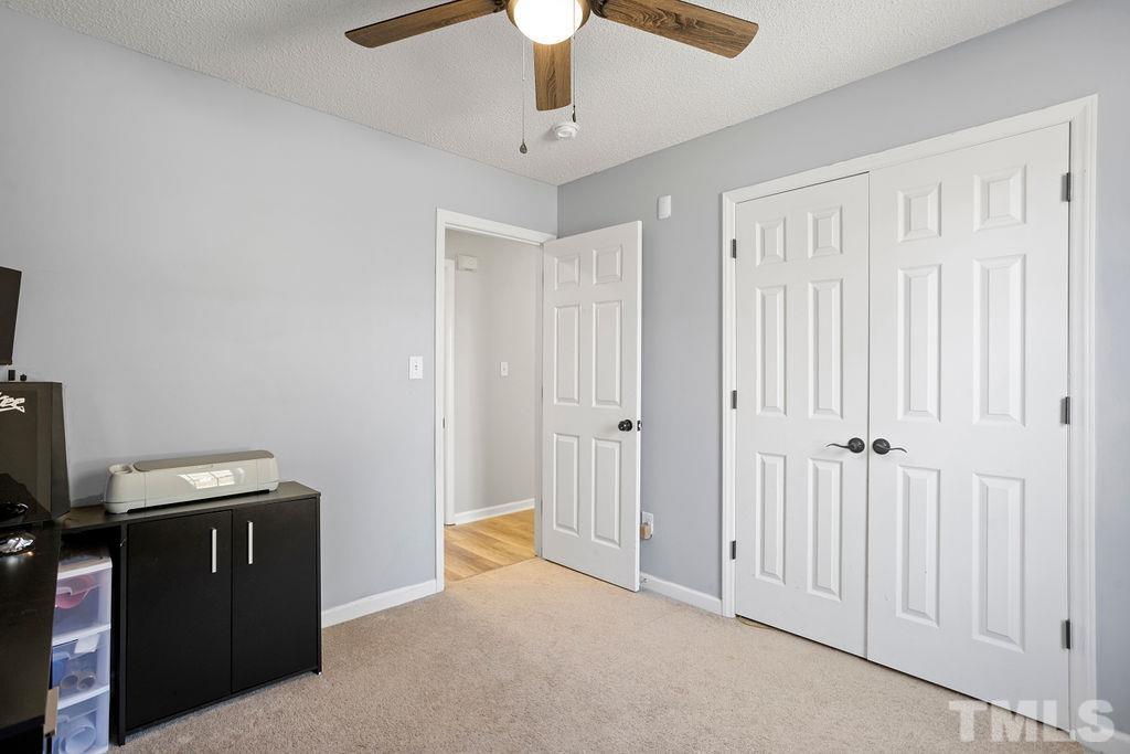 7929 Flower Hill Road Middlesex, NC 27557 - Photo 19 of 28 a view of a room with cabinet cabinet and a chandelier fan