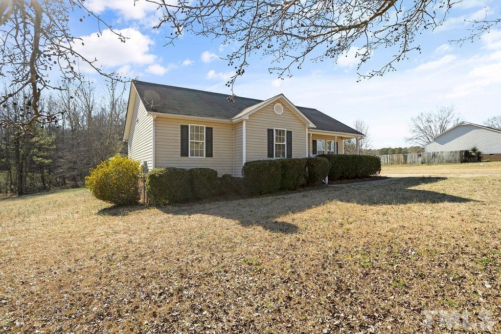 7929 Flower Hill Road Middlesex, NC 27557 - Photo 2 of 28 a front view of a house with a yard