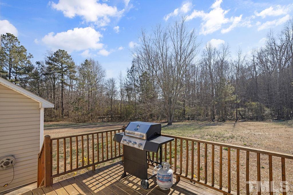 7929 Flower Hill Road Middlesex, NC 27557 - Photo 23 of 28 a view of a two chairs on the roof deck