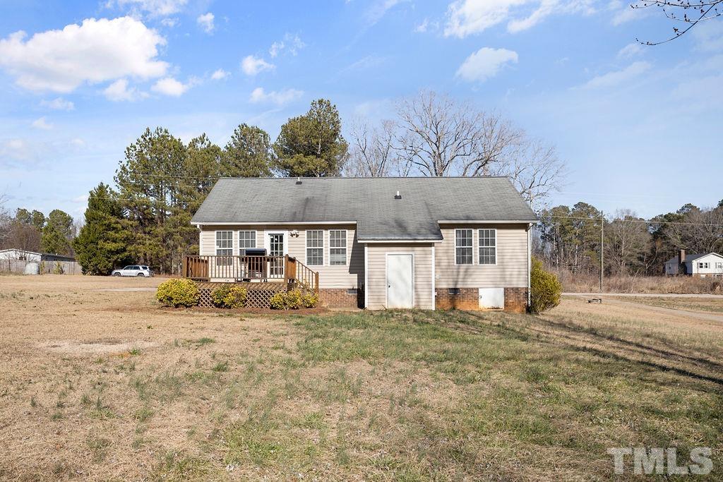 7929 Flower Hill Road Middlesex, NC 27557 - Photo 24 of 28 a front view of house with yard and trees in the background