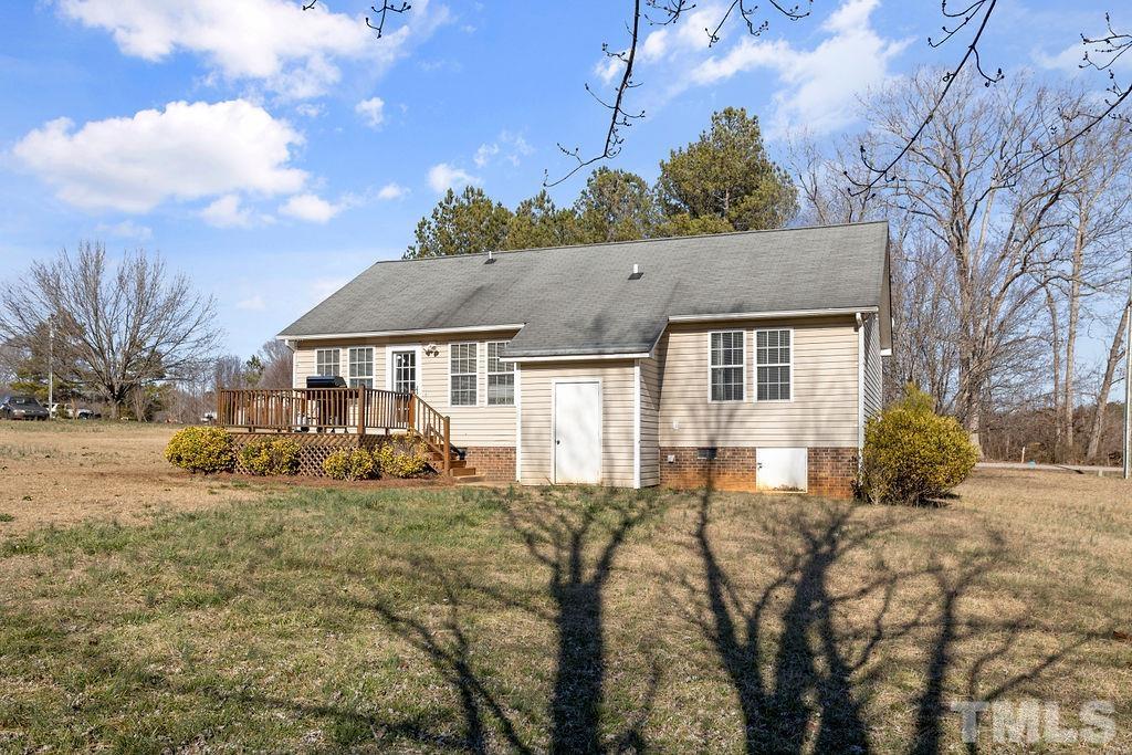 7929 Flower Hill Road Middlesex, NC 27557 - Photo 25 of 28 a front view of house with yard and trees in the background