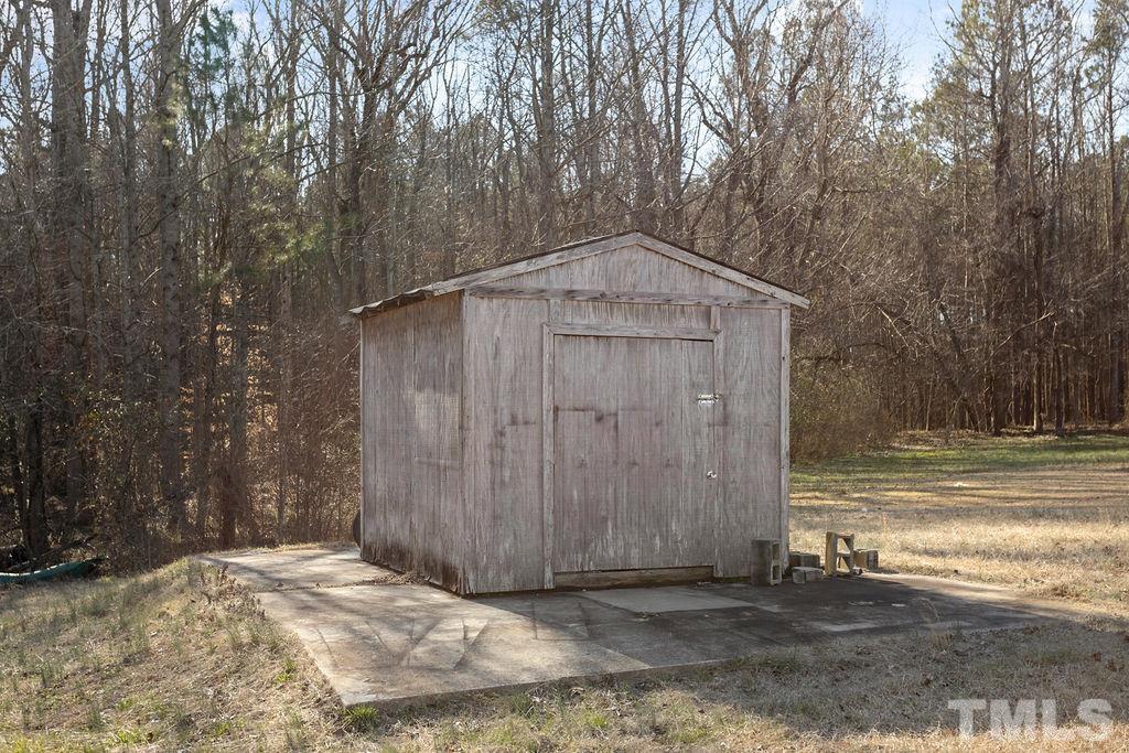 7929 Flower Hill Road Middlesex, NC 27557 - Photo 28 of 28 a view of a wooden door in front of a house