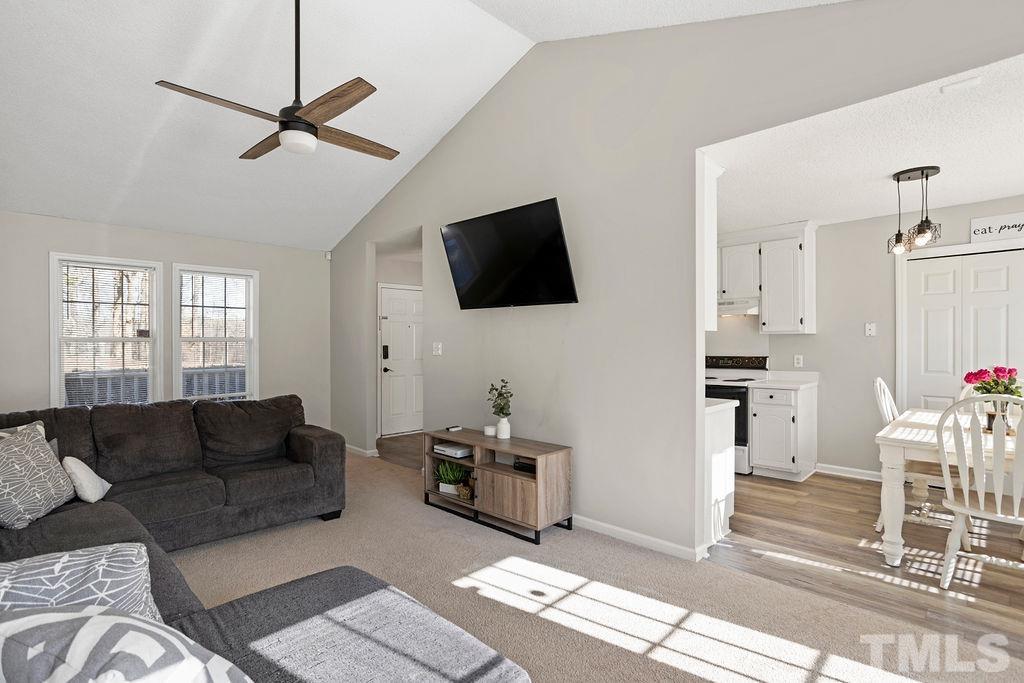 7929 Flower Hill Road Middlesex, NC 27557 - Photo 9 of 28 a living room with furniture and a flat screen tv