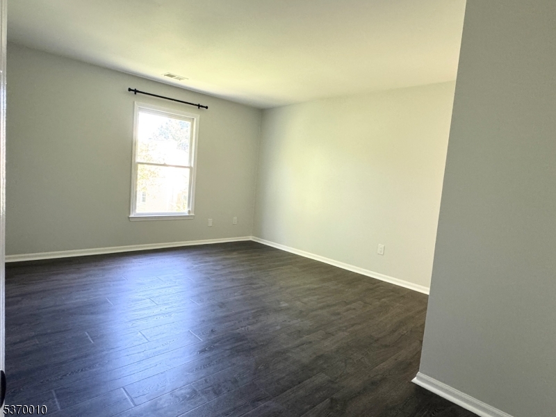 76 Jamestown Road Bernards, NJ 07920 - Photo 11 of 20 an empty room with wooden floor and windows