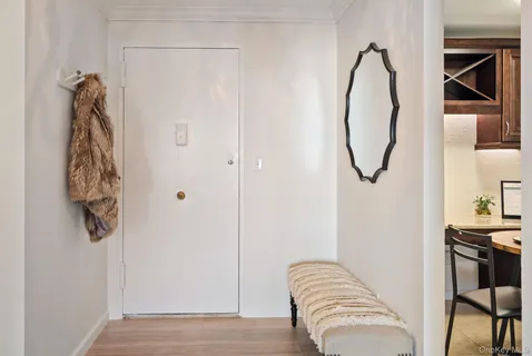 a view of a room with rack and furniture