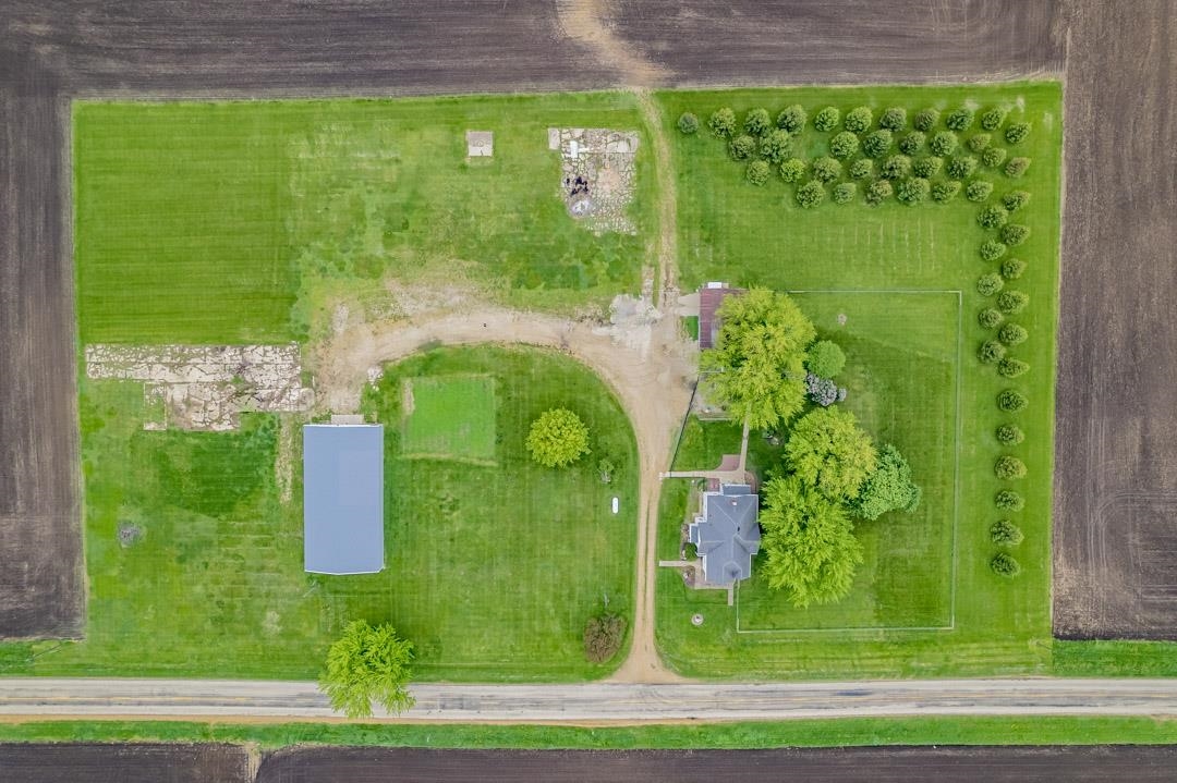 13269 East Holcomb Road Davis Junction, IL 61020 - Photo 27 of 34 a green field with trees in the background