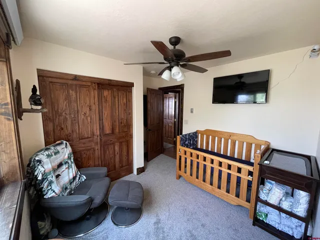 a bedroom with furniture and a window