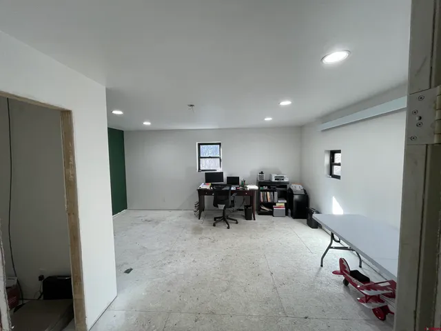 a view of livingroom with furniture and rug