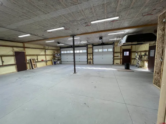 a view of a empty room with gym equipment