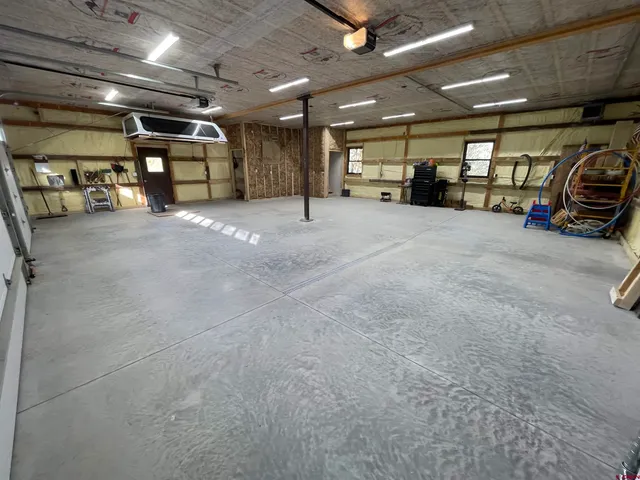 a view of parking area with parked car