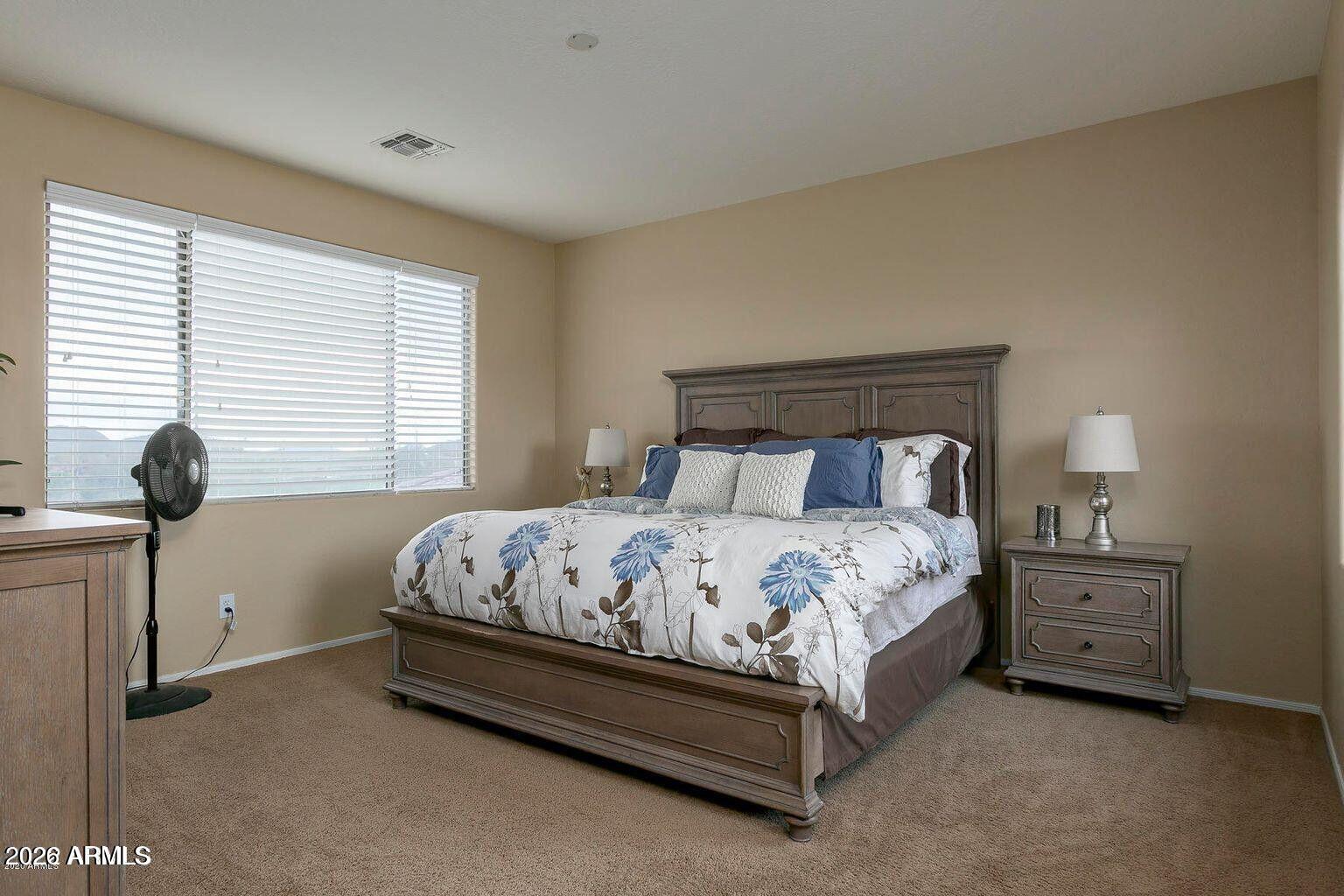 2023 West Shackleton Drive Phoenix, AZ 85086 - Photo 7 of 11 a bedroom with a bed and a window