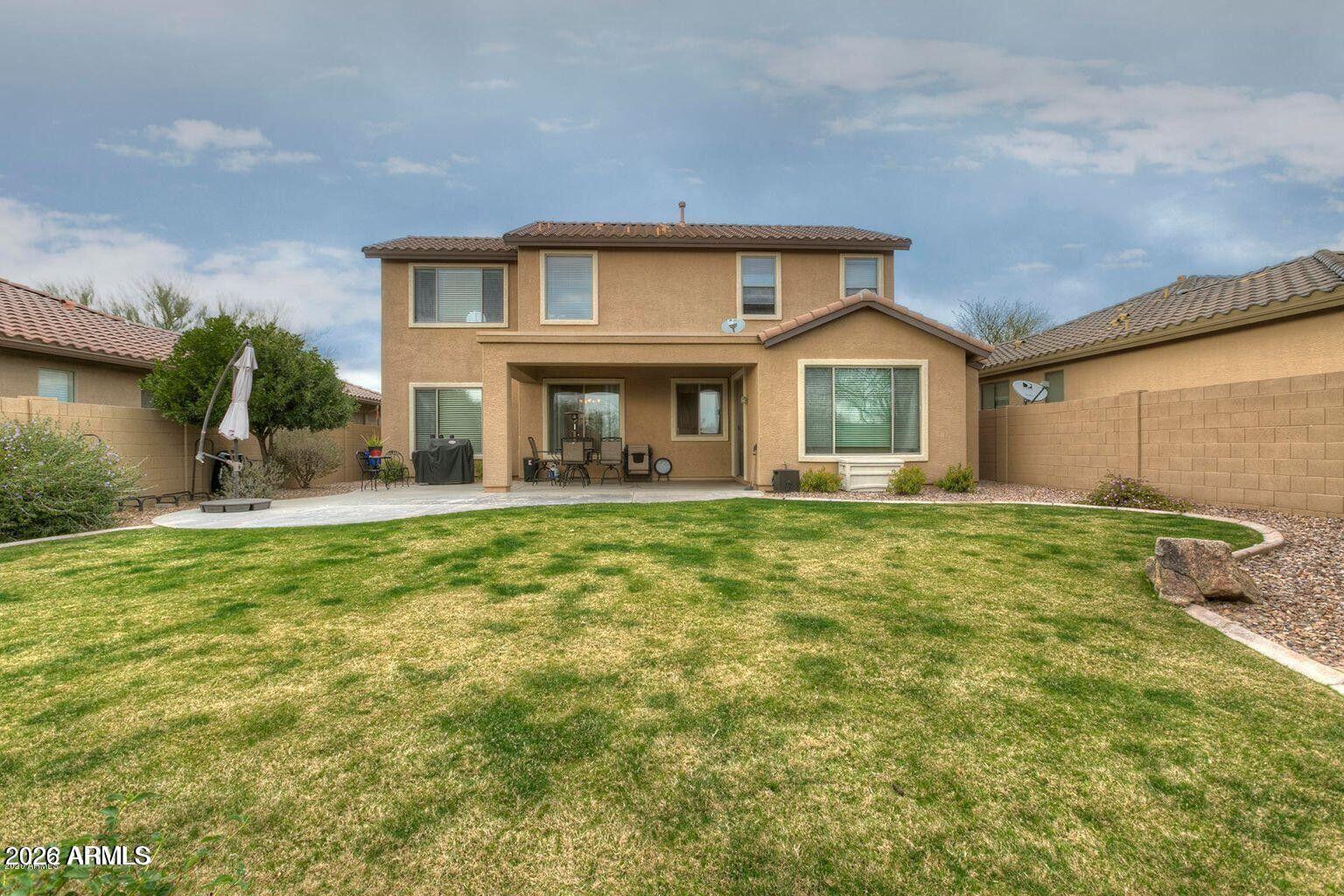 2023 West Shackleton Drive Phoenix, AZ 85086 - Photo 10 of 11 a front view of a house with a garden
